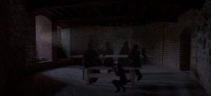 Pimeä sali, johon on piirretty tummia hahmoja